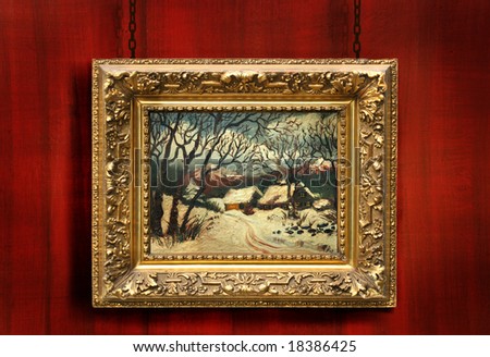 Red wood background with antique gold frame with painting