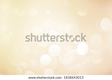 Gold abstract background with blurred bokeh. Blurred lights background. Abstract bokeh lights with soft light background. Bokeh pattern. Wallpaper. Bokeh background.
