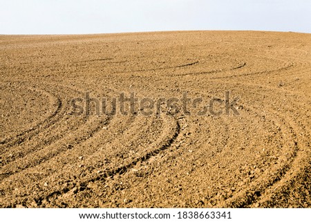 ploughed fertile soil agricultural field that is cultivated to produce a good crop of agricultural goods, rural area