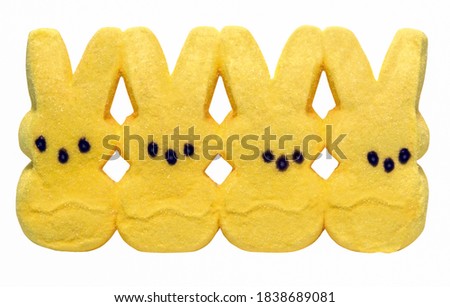 Expressionless yellow marshmallow Easter bunnies. Isolated. Royalty-Free Stock Photo #1838689081