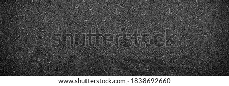 wide black asphalt texture. asphalt road. stone asphalt texture background black granite gravel.