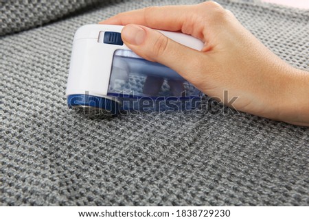 Modern Electric Fabric Shaver and Wool Sweater