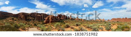 Panoramic photo of Moab park in Utah. Red rocks and blue sky on the desert. 