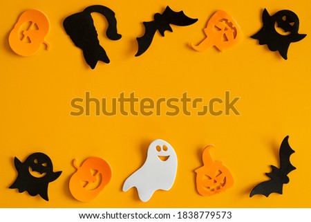 Halloween symbols on an orange background. Halloween festive background. Halloween concept..