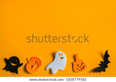 Halloween symbols on an orange background. Halloween concept.
