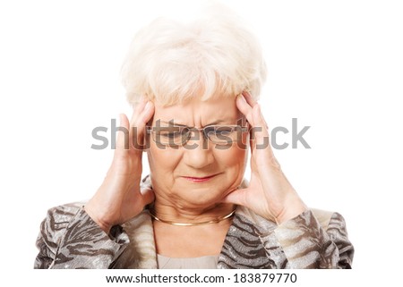 An old elegant lady is having a headache. Isolated on white. 