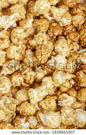 Popcorn Pattern. A pile of popcorn. Sweets. Popcorn Pattern. Caramel popcorn textured background. Food, cinema, movie. Top view. 