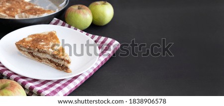 Homemade apple pies on dark background. Autumn dessert.