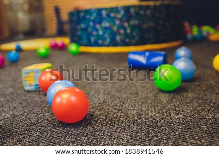 Balloons of different colors lie on the floor as a decoration for a children's party or birthday.