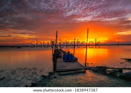 Golden orange sunset over the jetty at Kota Tinggi, Johore