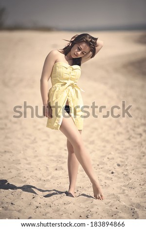 Young girl posing on the beach