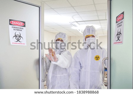 Quarantine Area room with two scientists hand stop sign do not entry healthcare service concept in hospital