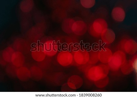 red bokeh on a black background, out of focus, red background, blurry background, round lights in out of focus , horizontal.
