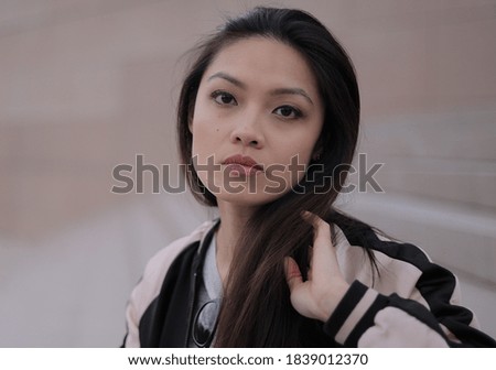 Young Asian woman in a city - people photography