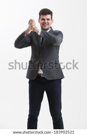 Handsome Businessman in a nice suit showing signs by his hands.  Tall man in a gray suit.