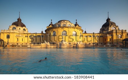 Budapest Spa Szechenyi Bath people swimming at sunset Royalty-Free Stock Photo #183908441