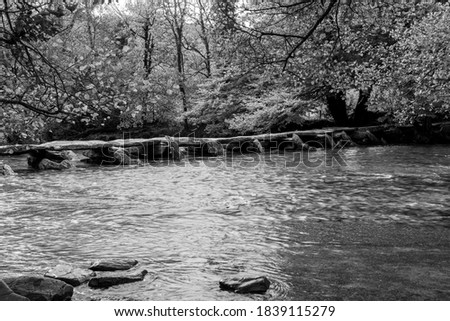 Black and white photo of the clapper bridge at Tarr Steps in Exmoor National Park