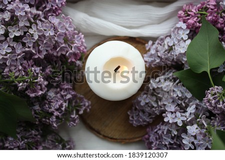 Spring still life with lilacs and candles