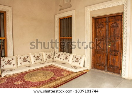 Traditional Arabic style seating area with carpet and cushions in the United Arab Emirates Royalty-Free Stock Photo #1839181744