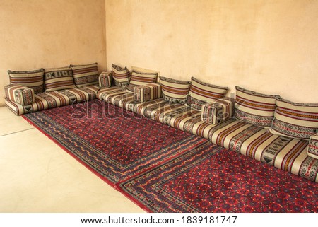 Traditional Arabic style seating area with carpet and cushions in the United Arab Emirates Royalty-Free Stock Photo #1839181747