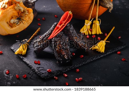 black rib grill for halloween. Menu on Halloween. Autumn and thanksgiving celebration table setting
