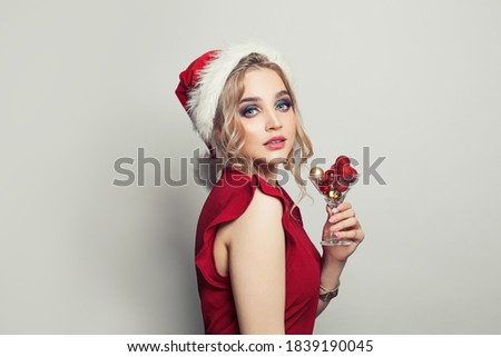 Beautiful woman Santa on white background, Christmas and  New Year party portrait