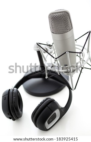 Studio microphone for recording podcasts with headset on a white background.