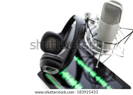 Studio microphone for recording podcasts with headset on a white background.