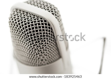 Studio microphone for recording podcasts on a white background.
