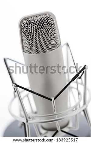 Studio microphone for recording podcasts on a white background.