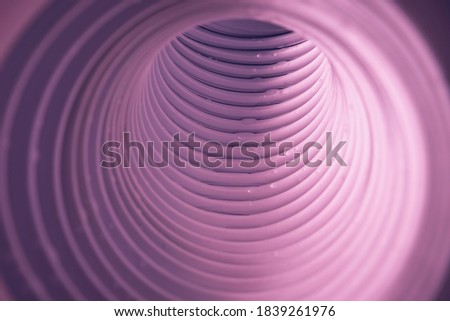 Beautiful round abstract pink tunnel with color light on a background pattern textured ford design.
