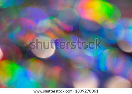 Abstract Rainbow Bokeh. Many iridescent blurred circles. Festive Christmas or New Year background.