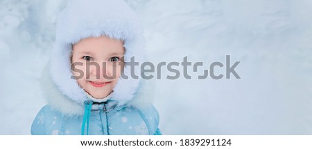 happy girl in a fur hat