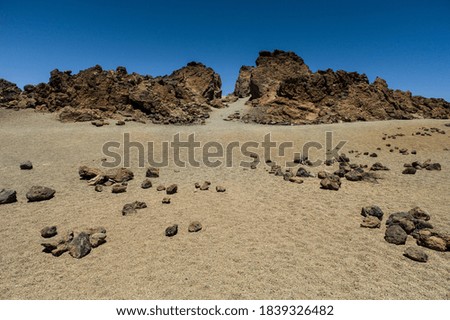 Volcanic stone desert at Teide, Tenerife Royalty-Free Stock Photo #1839326482