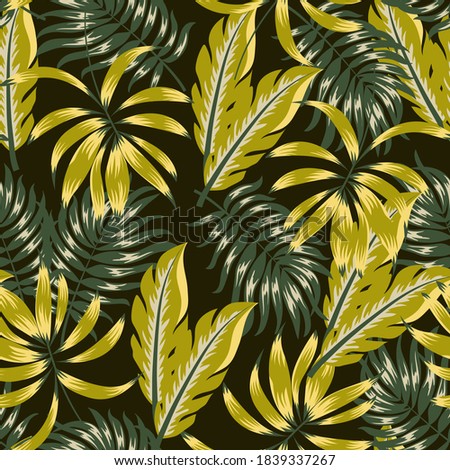 Abstract seamless tropical pattern with bright plants and leaves on a dark background. Seamless pattern with colorful leaves and plants. Tropical botanical.