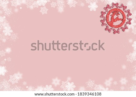 background, Christmas postcard decorated with snowy borders bows and reindeer figure