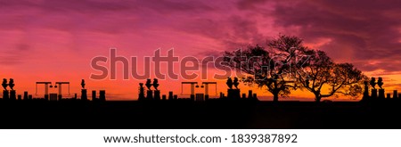 silhouette of large industrial On the ืnature,Causing air pollution and Water pollution.On the sunset background.Environmental conservation concept.
