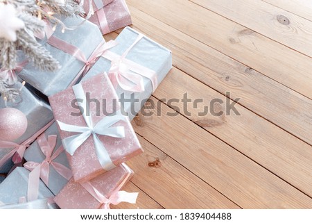 Gift boxes on a wooden floor from top view with place for text.