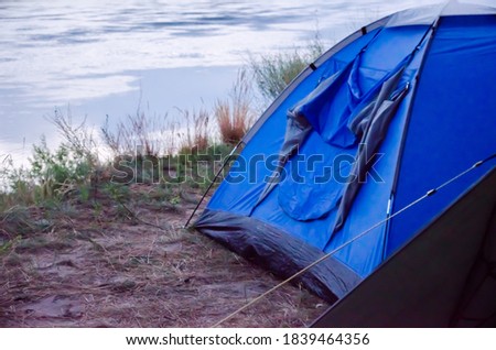  rest tent. tent by the river. rest by the river. High quality photo