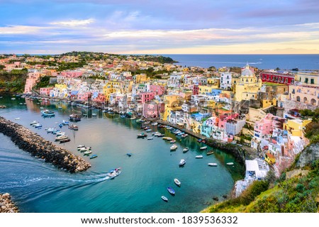 Procida island, Naples, Italy, colorful houses in Marina di Corricella harbour in dramatic sunrise light Royalty-Free Stock Photo #1839536332