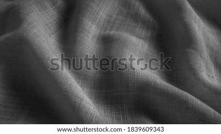 abstract photo of black and white fabric texture detail.