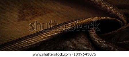 silk fabric, color brown, delicate pattern, pattern in the form of a combination of lines, shadows. texture background. template. chocolate