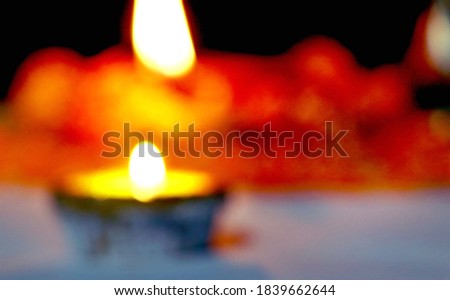 Diwali - an Indian festival of lights which is now celebrated all over the world. An abstract blurred background picture of diya oil lamp