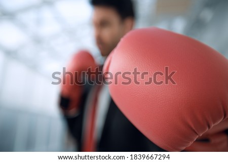 confident businessman in Boxing gloves.