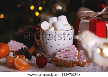 cup of coffee and marshmallows. Presents, gingerbread and Christmas decorations
