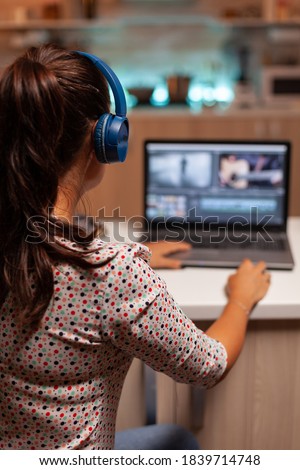 Content creator working in home during night time . Royalty-Free Stock Photo #1839714748