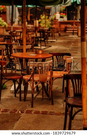 restaurant tables on the street. wooden furniture