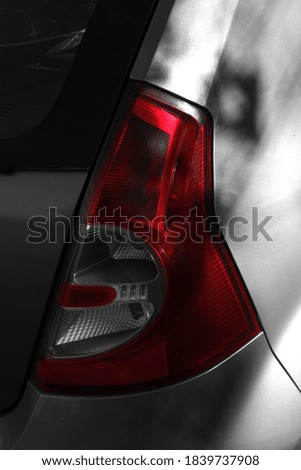 Close-up shot of a bright red car tail light. 