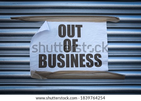 Grungy Out Of Business Sign On Some Old Store Shutters, A Consequence Of The 2020 COVID Pandemic Royalty-Free Stock Photo #1839764254