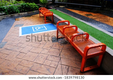 Wheelchair symbol at parking space reserved